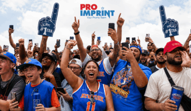 Fans at the New York Knicks Victory Parade using branded foam fingers, apparel, and drinkware, illustrating the role of promotional products in event engagement and brand visibility.