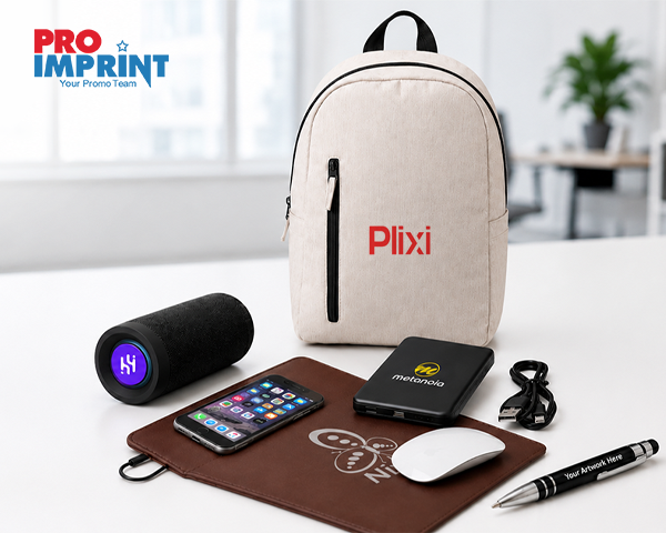 Promotional tech products including a branded backpack, speaker, power bank, mouse pad, and pen displayed as smart business swag.